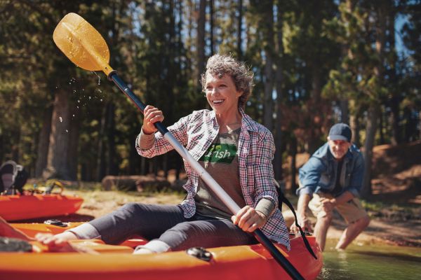 Woman kayaking wearing MyNurish shirt